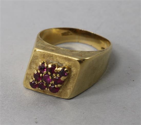 An 18ct gold and ruby cluster cocktail ring, size K.